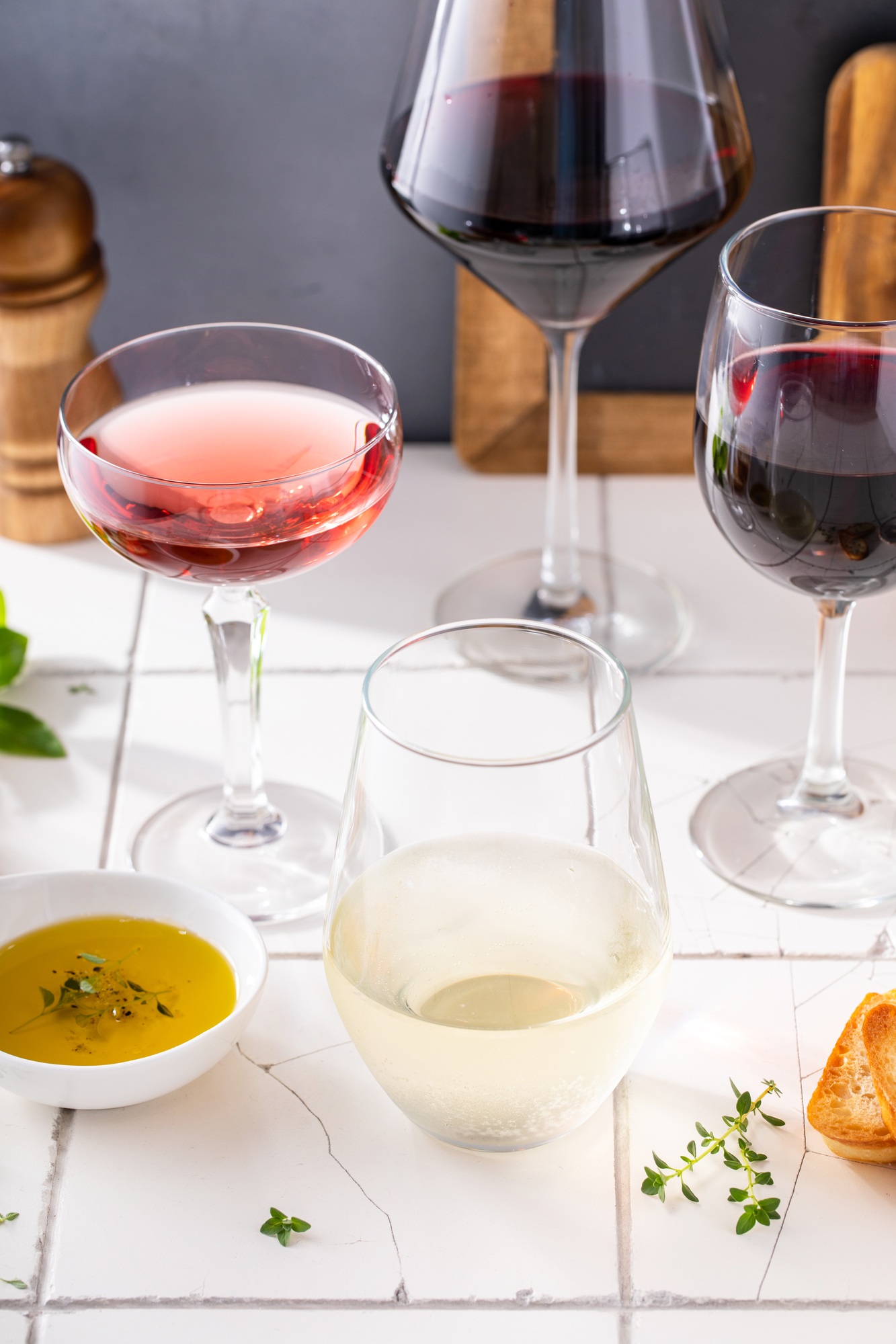 Variety of wine glasses with red, white and rose wine